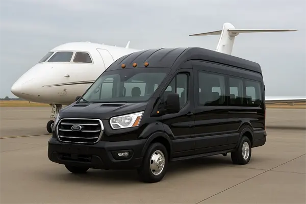 "“Solano Airport Shuttle van parked near airplane, offering reliable airport transfer service.”