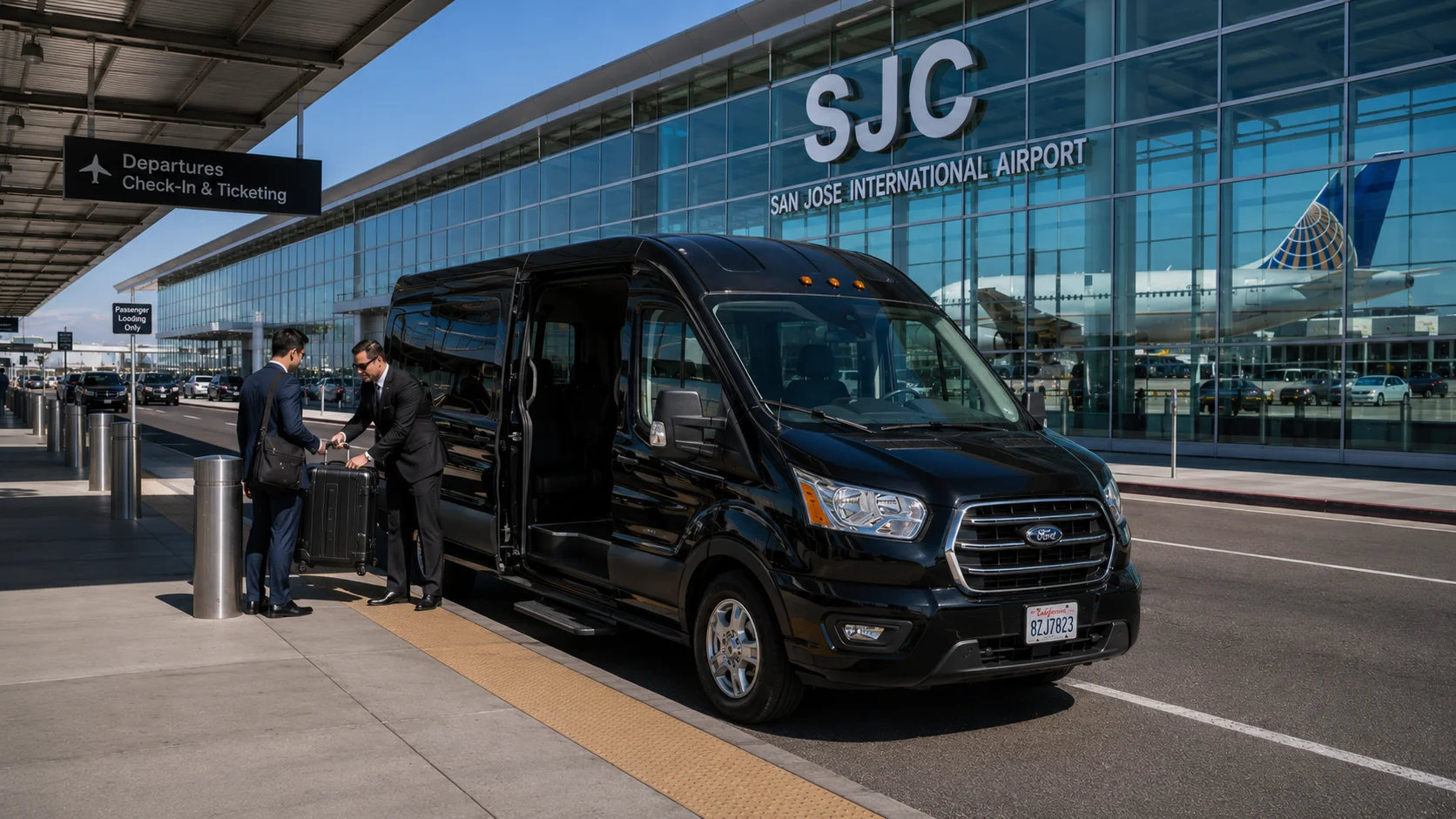 Black luxury SUV parked at San Jose International Airport SJC terminal with luggage assistance for Fairfield transfer service